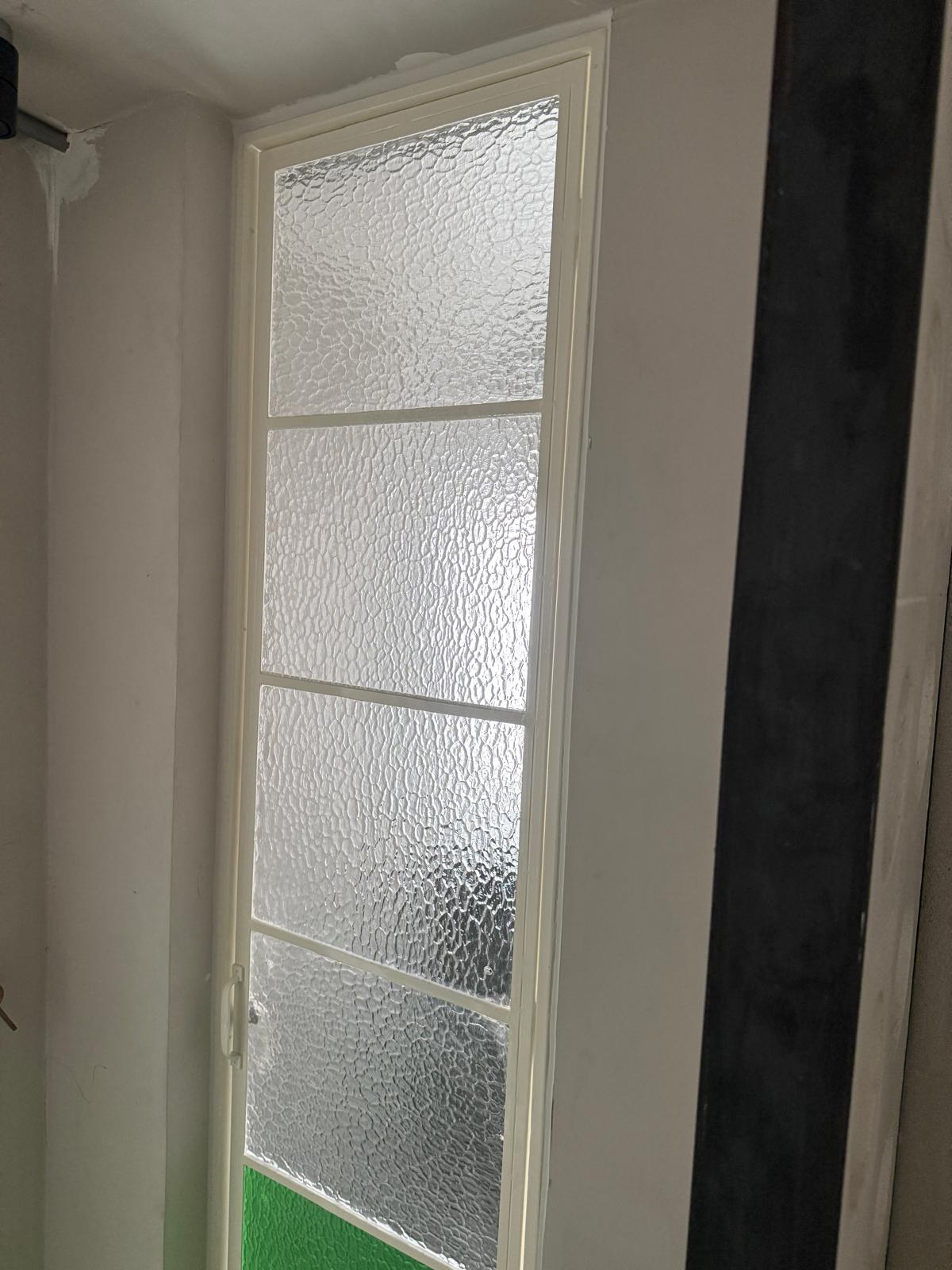 Textured-glass window detail from the Guan Chuan supply project